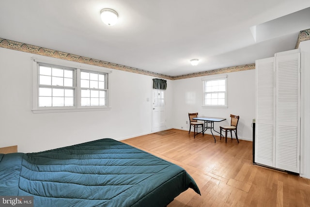 bedroom with wood-type flooring