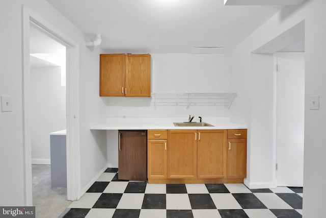 2905 Tilden St NW, Washington, DC 20008 - kitchen featuring a sink, light flooring, light countertops, and brown cabinets