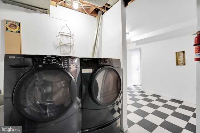 2905 Tilden St NW, Washington, DC 20008 - clothes washing area with tile patterned floors and independent washer and dryer