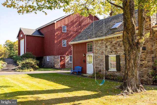 back of house with a yard