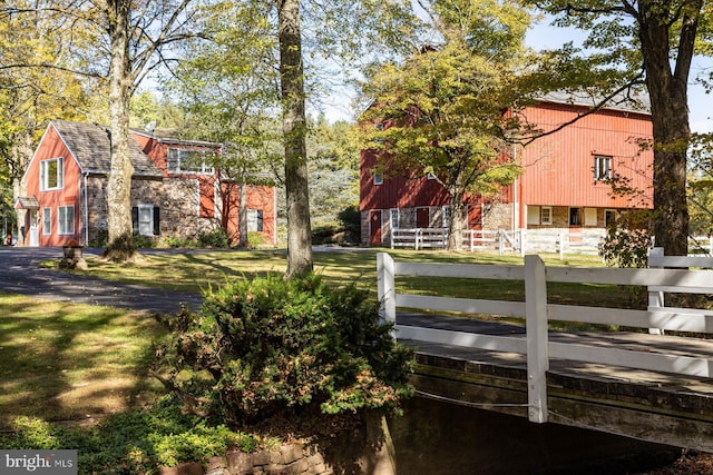 view of property's community with a lawn and a wooden deck