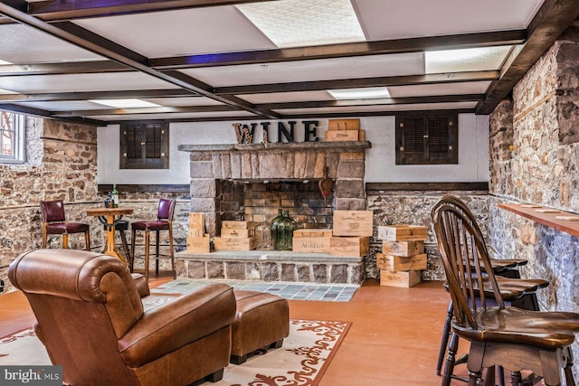 living room featuring beamed ceiling