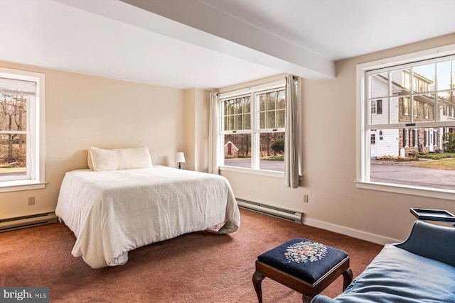 bedroom with multiple windows, dark colored carpet, and a baseboard radiator