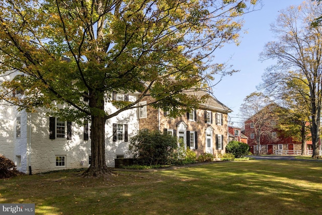 view of home's exterior featuring a lawn