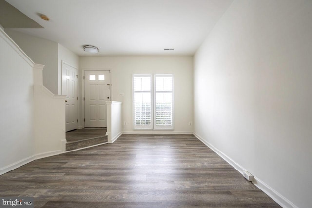 entrance foyer with dark hardwood / wood-style flooring