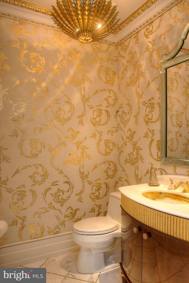 bathroom with vanity, toilet, and tile patterned flooring