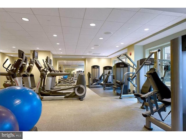 exercise room featuring a paneled ceiling