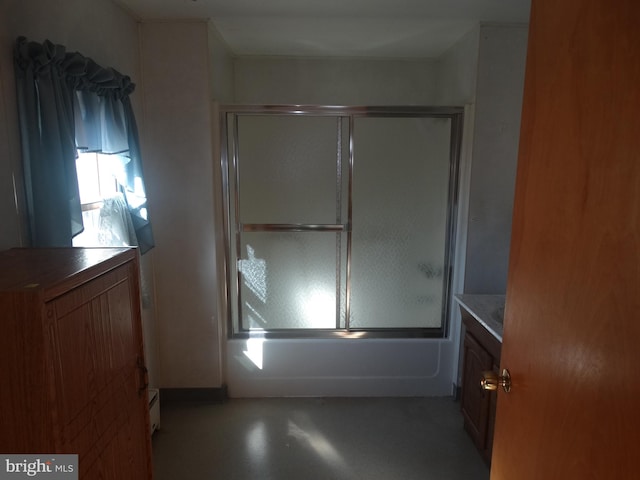 bathroom featuring vanity and shower / bath combination with glass door