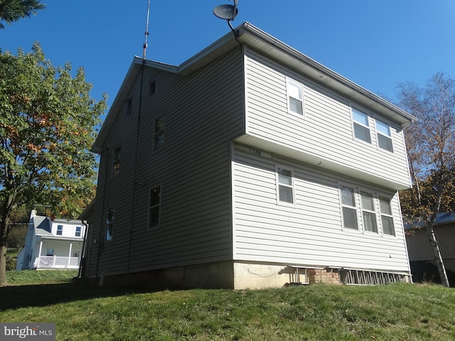 view of property exterior featuring a yard