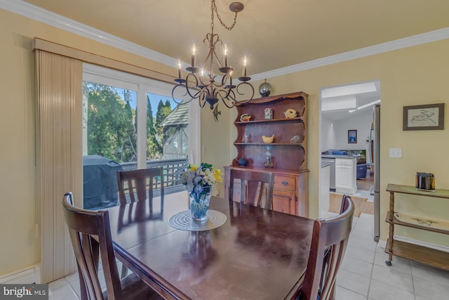 dining room featuring crown molding, a notable chandelier, and light tile patterned floors