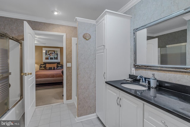 bathroom with vanity, ornamental molding, tile patterned flooring, and bath / shower combo with glass door