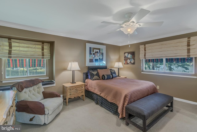 bedroom with carpet, multiple windows, crown molding, and ceiling fan