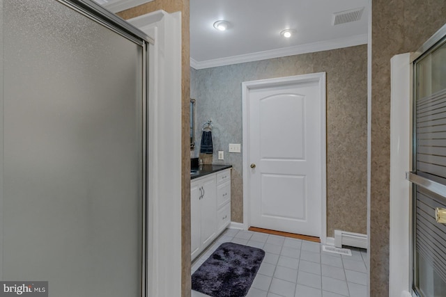 bathroom with vanity, ornamental molding, walk in shower, and tile patterned flooring