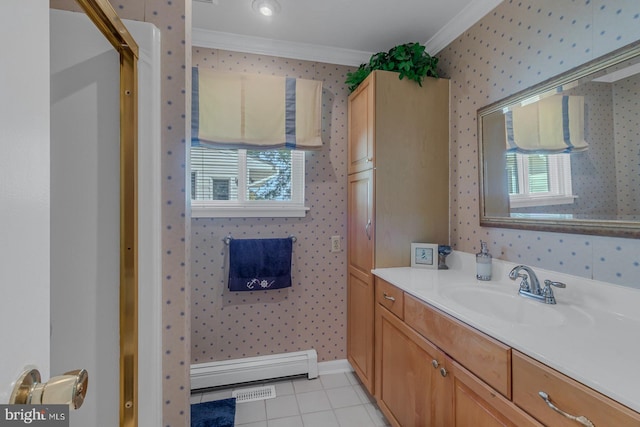 bathroom featuring baseboard heating, vanity, crown molding, and tile patterned flooring