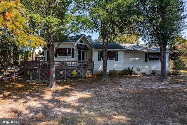 ranch-style home with a deck