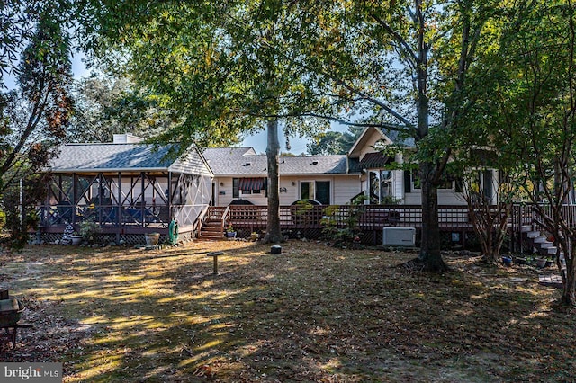 back of property featuring a sunroom