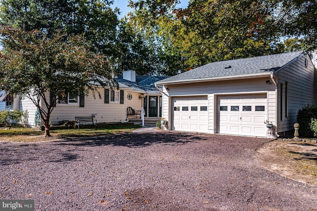 ranch-style home featuring a garage