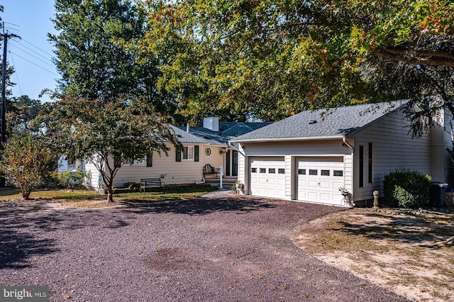 ranch-style house featuring a garage