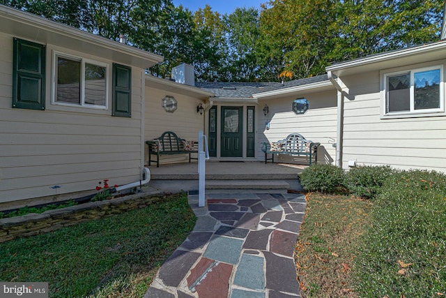 entrance to property with a patio area