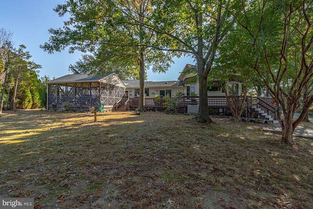 view of yard with a sunroom