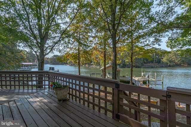 deck featuring a dock and a water view