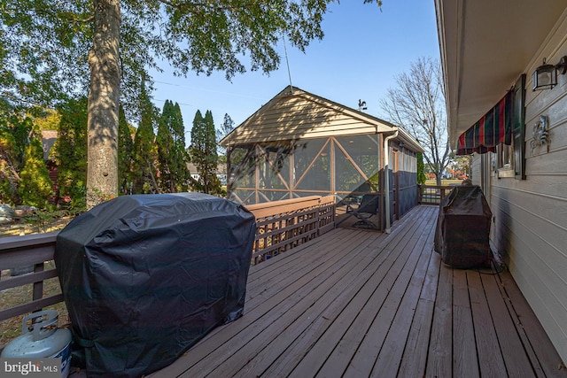 wooden deck featuring area for grilling