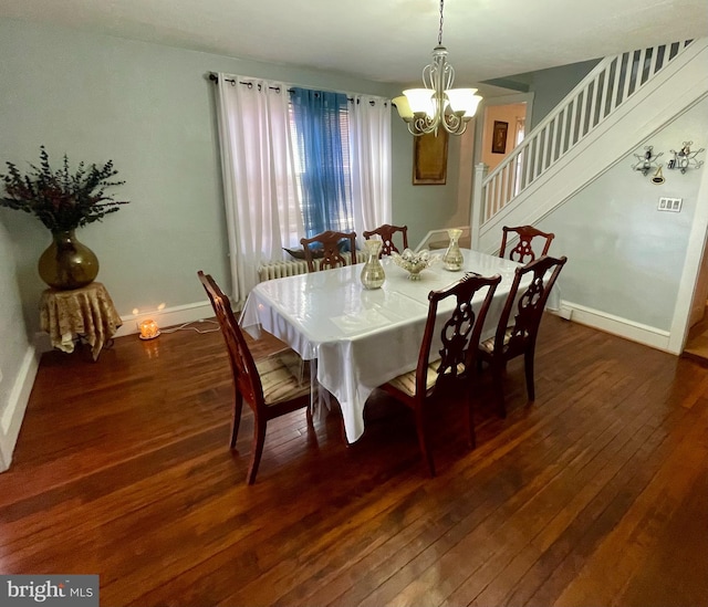 dining space featuring a chandelier and dark hardwood / wood-style floors