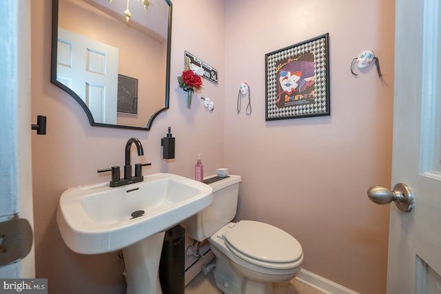 bathroom featuring toilet and sink