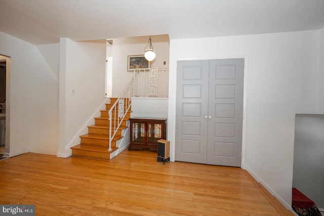 stairway featuring hardwood / wood-style flooring