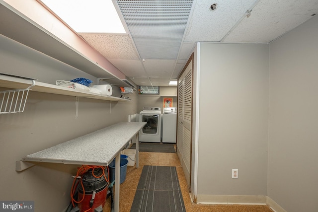 laundry area featuring light carpet and washer and dryer