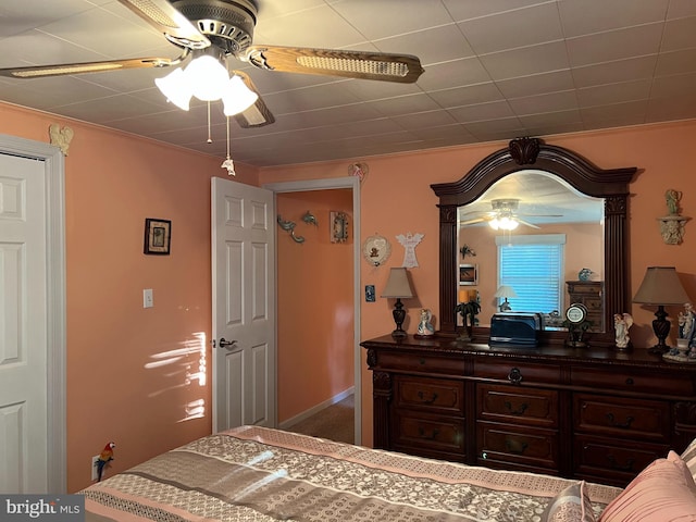 bedroom featuring ceiling fan and crown molding