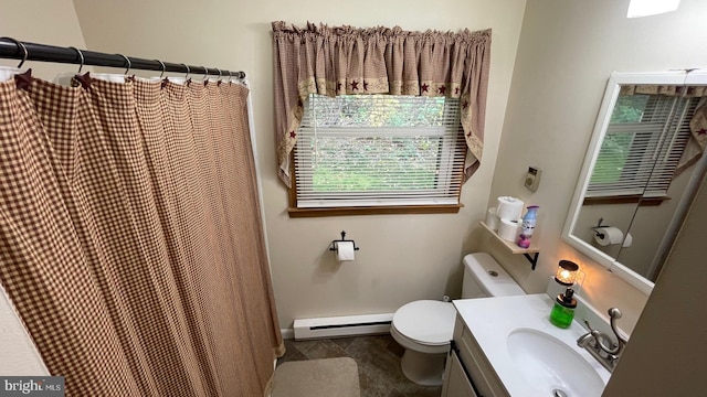 bathroom featuring vanity, toilet, baseboard heating, and a shower with shower curtain