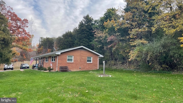 view of property exterior featuring a yard