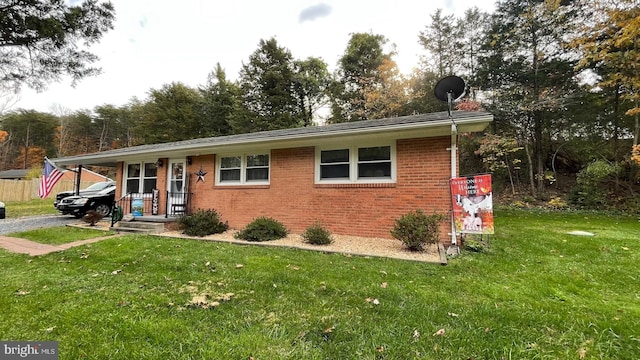 view of front of home with covered porch and a front yard