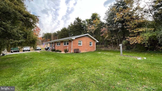 view of side of property with a yard