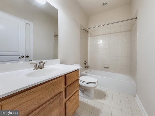 full bathroom with vanity, toilet, tiled shower / bath combo, and tile patterned flooring