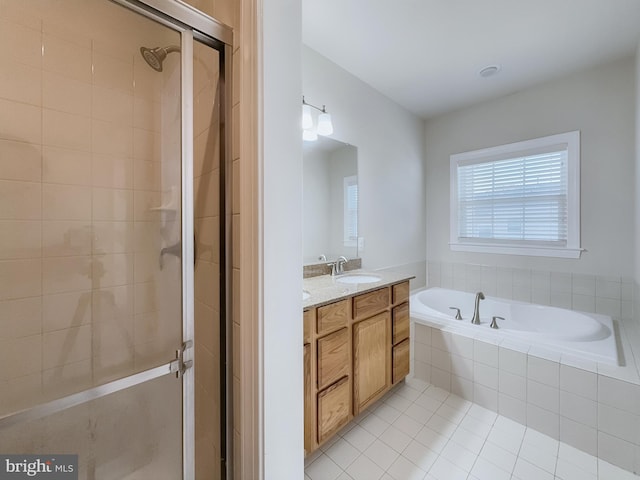 bathroom with vanity, separate shower and tub, and tile patterned flooring