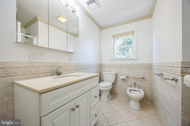 bathroom featuring toilet, tile patterned flooring, a bidet, tile walls, and vanity