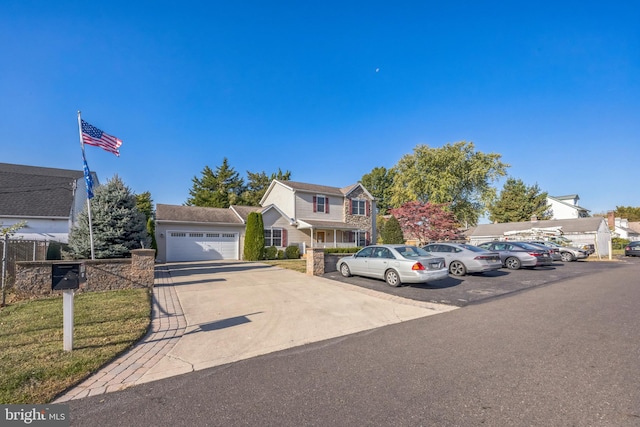 view of property with a front yard and a garage