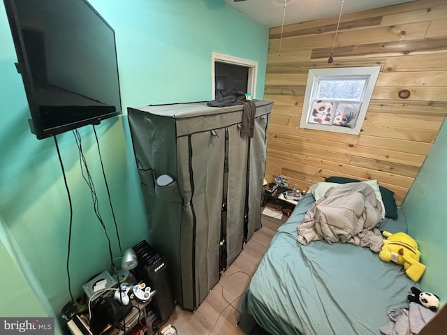 bedroom with wooden walls