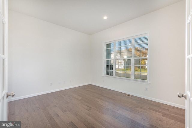 empty room featuring wood-type flooring