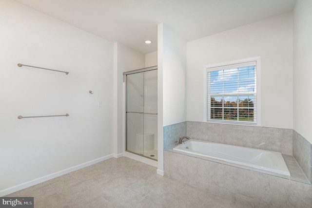 bathroom with tile patterned flooring and shower with separate bathtub