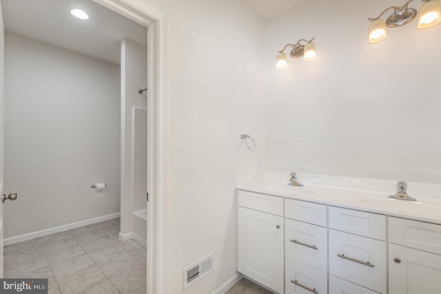 bathroom with vanity and tile patterned floors