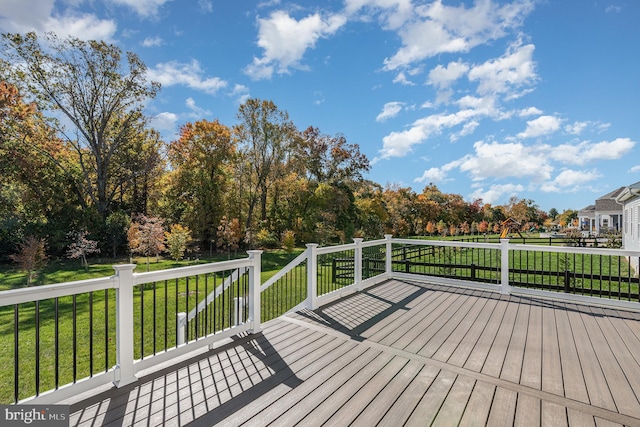 wooden terrace with a yard