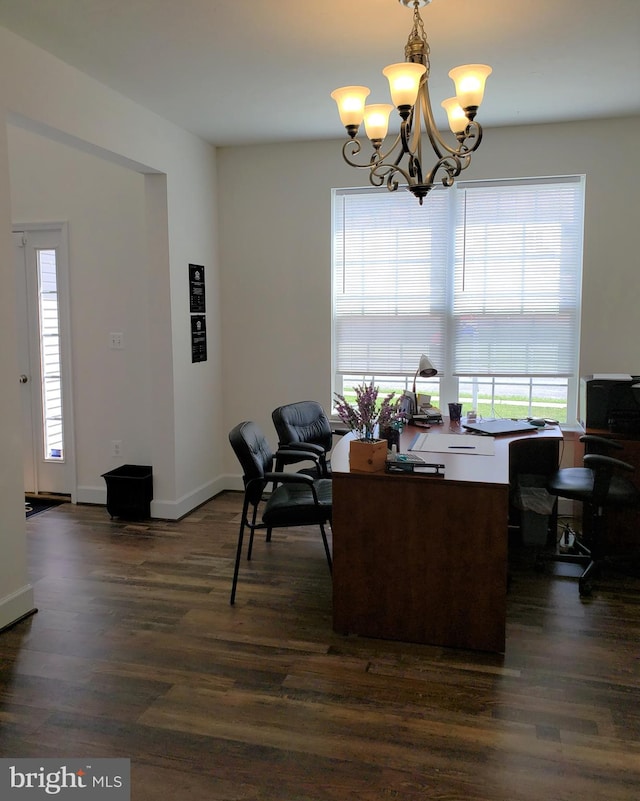 dining room featuring a chandelier and dark hardwood / wood-style flooring