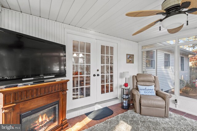 sunroom / solarium featuring french doors and wooden ceiling