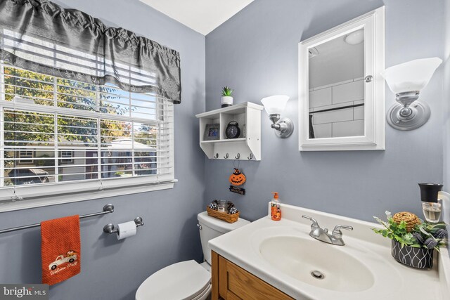 bathroom with vanity and toilet