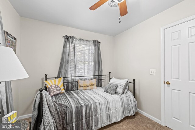 carpeted bedroom featuring ceiling fan