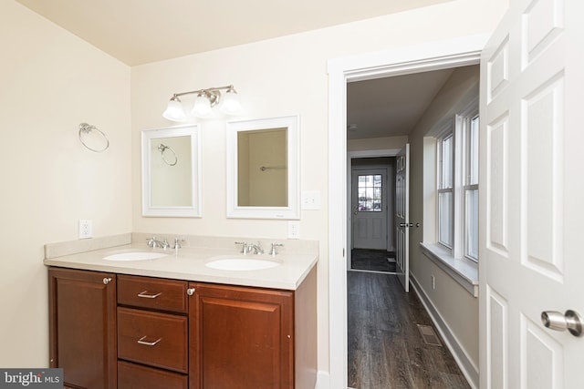 bathroom featuring vanity and hardwood / wood-style floors