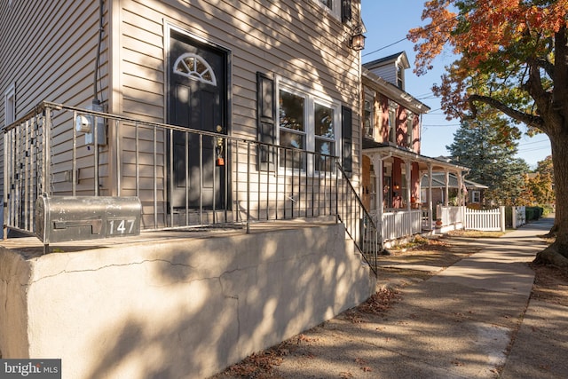 view of property exterior with a porch